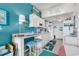 Kitchen with white cabinets, teal walls, and breakfast bar at 6803 N Ocean Blvd. # 230, Myrtle Beach, SC 29572