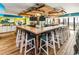 L-shaped bar with rustic wood and modern finishes, features ocean views at 2301 Ocean Blvd. S # 1218, Myrtle Beach, SC 29577
