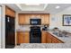 Fully equipped kitchen with granite countertops and wood cabinets at 2301 Ocean Blvd. S # 1218, Myrtle Beach, SC 29577