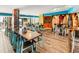 Casual restaurant with multiple tables and surfboards as decor at 2301 Ocean Blvd. S # 1218, Myrtle Beach, SC 29577