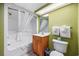 Clean bathroom with tub shower and wood vanity at 2301 Ocean Blvd. S # 1218, Myrtle Beach, SC 29577