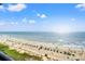 Expansive ocean view with beach umbrellas and people enjoying the sand at 7100 N Ocean Blvd. # 913, Myrtle Beach, SC 29572