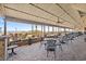 Outdoor dining area with ocean views and ceiling fans at 7100 N Ocean Blvd. # 913, Myrtle Beach, SC 29572