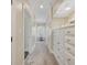 Bright hallway with built-in storage and window at 4400 Saint Andrews Ct., Murrells Inlet, SC 29576