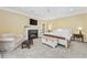 Spacious primary bedroom with fireplace and sitting area at 4400 Saint Andrews Ct., Murrells Inlet, SC 29576