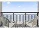 Balcony with ocean view and two chairs at 1501 Ocean Blvd. S # 1140, Myrtle Beach, SC 29577