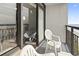 Private balcony with ocean view and seating at 1501 Ocean Blvd. S # 1140, Myrtle Beach, SC 29577