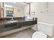 Bathroom with granite vanity and toilet at 1501 Ocean Blvd. S # 1140, Myrtle Beach, SC 29577