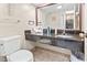 Bathroom with granite vanity and toilet at 1501 Ocean Blvd. S # 1140, Myrtle Beach, SC 29577