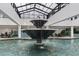 Indoor pool with a large fountain as a centerpiece at 1501 Ocean Blvd. S # 1140, Myrtle Beach, SC 29577
