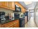 Kitchen features granite countertops and black appliances at 1501 Ocean Blvd. S # 1140, Myrtle Beach, SC 29577
