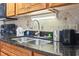 Kitchen sink with granite countertop and modern faucet at 1501 Ocean Blvd. S # 1140, Myrtle Beach, SC 29577