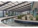 Indoor lazy river with a covered, plant-filled area at 1501 Ocean Blvd. S # 1140, Myrtle Beach, SC 29577