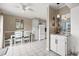 Kitchen and dining area with white cabinets, granite counters and tile floors at 5905 South Kings Hwy. # A246, Myrtle Beach, SC 29575