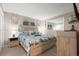 Main bedroom with a dresser, large bed, and beach-themed decor at 5905 South Kings Hwy. # A246, Myrtle Beach, SC 29575