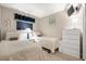 Bedroom with twin beds and white dresser, beach themed decor at 5905 South Kings Hwy. # A246, Myrtle Beach, SC 29575