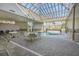Indoor heated pool with seating area and skylights at 5905 South Kings Hwy. # A246, Myrtle Beach, SC 29575