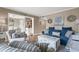Open living room with view into kitchen and dining area. Comfortable seating and hardwood floors at 5905 South Kings Hwy. # A246, Myrtle Beach, SC 29575