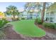 Community putting green with landscaping and building view at 5905 South Kings Hwy. # A246, Myrtle Beach, SC 29575