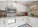 Updated kitchen with white cabinets, granite countertops, and stainless steel appliances at 5905 South Kings Hwy. # A246, Myrtle Beach, SC 29575