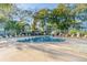 Heart-shaped pool surrounded by lounge chairs and lush trees at 5905 South Kings Hwy. # A246, Myrtle Beach, SC 29575