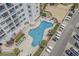 Inviting pool area with plenty of lounge chairs for relaxing at 5905 South Kings Hwy. # A246, Myrtle Beach, SC 29575