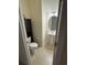 Small bathroom with pedestal sink, toilet, and dark wood cabinet at 1188 Fairway Ln. # 7, Conway, SC 29526