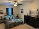 Elegant bedroom with a ceiling fan, metal bed frame, and dresser at 1188 Fairway Ln. # 7, Conway, SC 29526