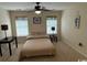 Spacious bedroom with a ceiling fan, carpeted floors, and plenty of natural light at 1188 Fairway Ln. # 7, Conway, SC 29526