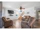 Spacious living room with hardwood floors, two sofas, and a TV at 6001 - 1870 S Kings Hwy., Myrtle Beach, SC 29575