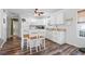 Kitchen with white cabinets, appliances, and a breakfast bar at 6001 - 1870 S Kings Hwy., Myrtle Beach, SC 29575