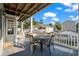 Deck with table and chairs, offering a relaxing outdoor space at 6001 - 1870 S Kings Hwy., Myrtle Beach, SC 29575