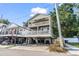 Two-story home with elevated design, balconies, and parking underneath at 6001 - 1870 S Kings Hwy., Myrtle Beach, SC 29575