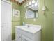Clean bathroom with white vanity and green walls at 6001 - 1870 S Kings Hwy., Myrtle Beach, SC 29575