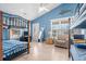 Bedroom with two bunk beds, a chair, and blue walls at 6001 - 1870 S Kings Hwy., Myrtle Beach, SC 29575