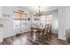 Bright dining area with wood table and chairs, hardwood floors, and a chandelier at 6001 - 1870 S Kings Hwy., Myrtle Beach, SC 29575