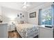 Cozy bedroom with a queen-size bed, window seating, and ample closet space at 6001 - 1870 S Kings Hwy., Myrtle Beach, SC 29575