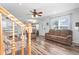 Living room with hardwood floors, sofas, and stairs to the upper level at 6001 - 1870 S Kings Hwy., Myrtle Beach, SC 29575