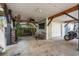 Covered patio with ceiling fan, seating area, and garage access at 6001 - 1870 S Kings Hwy., Myrtle Beach, SC 29575