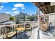 Deck with wicker chairs, a hammock, and neighborhood view at 6001 - 1870 S Kings Hwy., Myrtle Beach, SC 29575