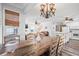Open concept dining area with a wooden table and kitchen view at 6001 - 1870 S Kings Hwy., Myrtle Beach, SC 29575