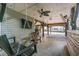Relaxing patio with swing, ceiling fan, and partial view of the street at 6001 - 1870 S Kings Hwy., Myrtle Beach, SC 29575