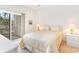 Bedroom with a queen-size bed and private balcony access at 1100 Commons Blvd. # 107, Myrtle Beach, SC 29572