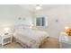 Bedroom with white wicker furniture and a floral bedspread at 1100 Commons Blvd. # 107, Myrtle Beach, SC 29572