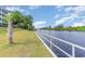 Calm waterway with lush greenery and a white railing at 1100 Commons Blvd. # 107, Myrtle Beach, SC 29572