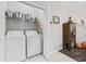 Convenient laundry room with washer, dryer, and shelving at 160 Freeboard Ln. # 802, Carolina Shores, NC 28467