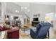 Spacious living room with hardwood floors, high ceilings, and a cozy seating area at 160 Freeboard Ln. # 802, Carolina Shores, NC 28467