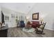 Open living room with hardwood floors, neutral decor, and ample natural light at 160 Freeboard Ln. # 802, Carolina Shores, NC 28467
