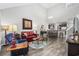 Bright living room features hardwood floors, vaulted ceilings, and comfortable seating at 160 Freeboard Ln. # 802, Carolina Shores, NC 28467