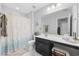 Bathroom with tub shower and vanity at 160 Freeboard Ln. # 802, Carolina Shores, NC 28467